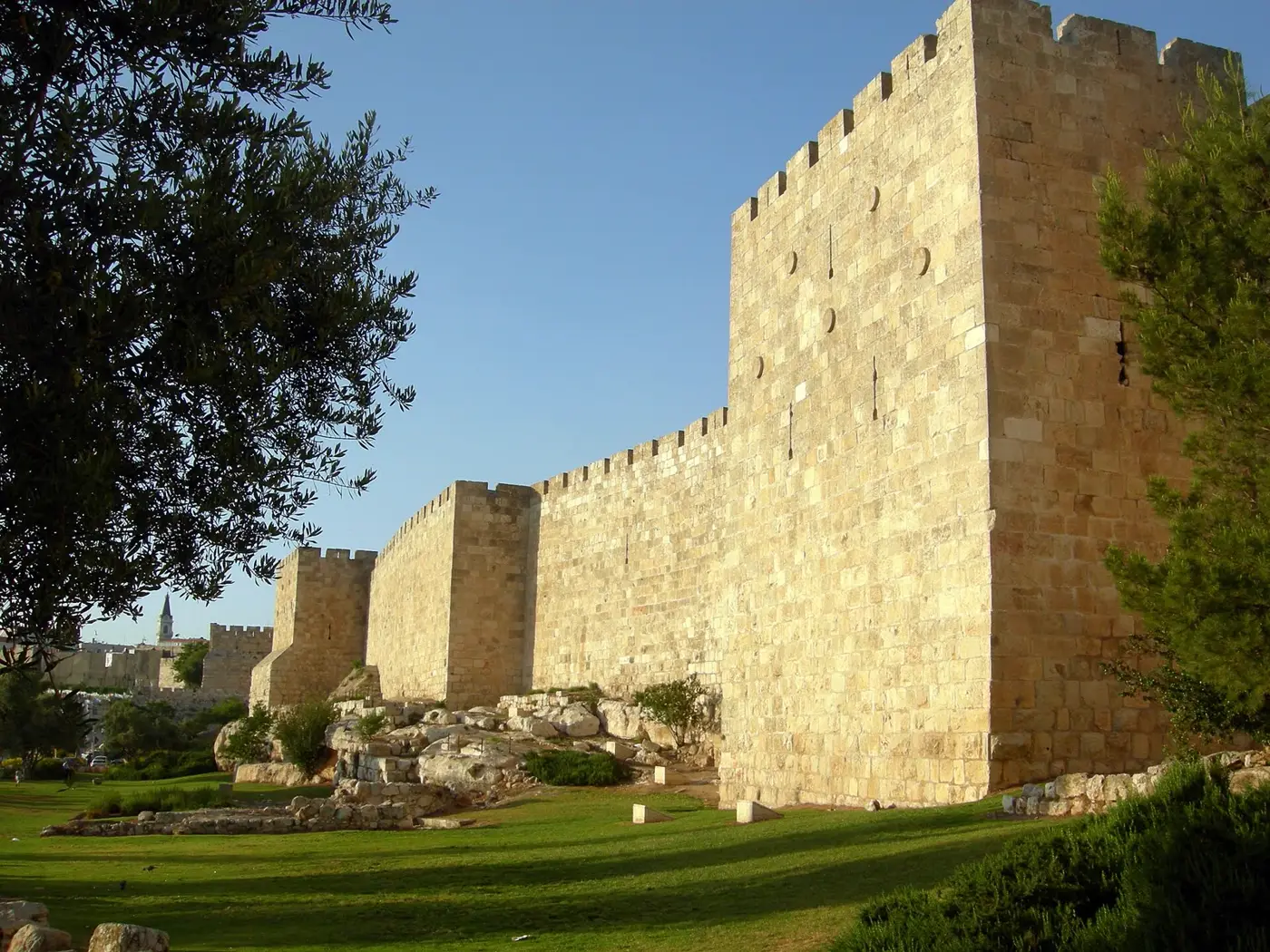 The golden stone walls of the Old City of Jerusalem in evening light