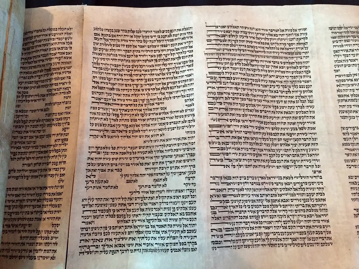 Close-up of Hebrew script on an open Torah scroll